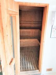 Wooden interior of a sauna with seating benches