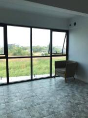 Living area with large windows and scenic view