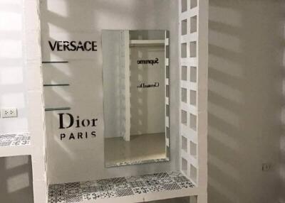 Fashion display area with mirrors and shelves