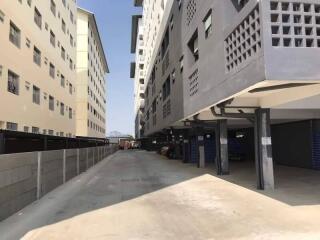 Exterior view of apartment buildings and parking area