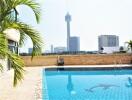 Outdoor area with swimming pool and city view