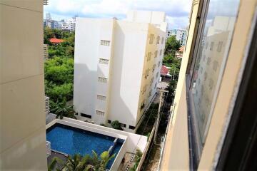 View of Swimming Pool and Buildings from a Window