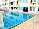 Outdoor communal swimming pool area of the building