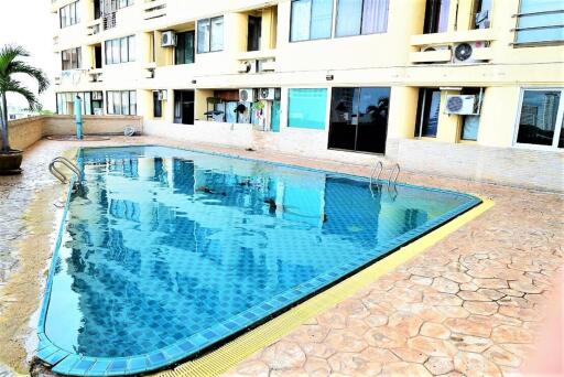 Outdoor communal swimming pool area of the building