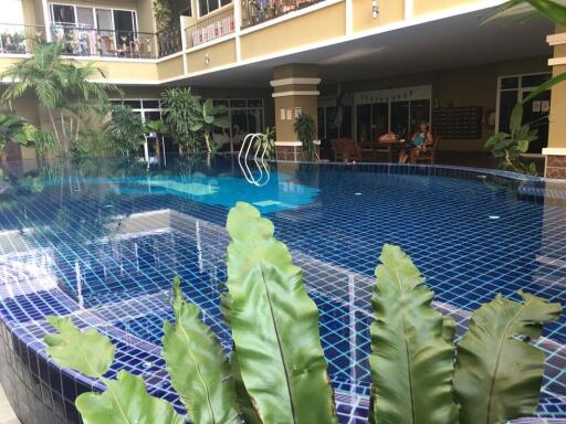 Outdoor swimming pool with surrounding greenery