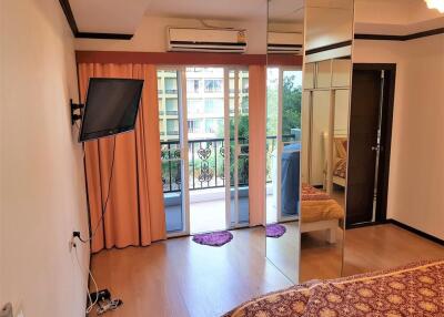 Bedroom with a view of the balcony and outdoor area