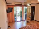 Bedroom with a view of the balcony and outdoor area