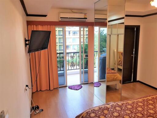 Bedroom with a view of the balcony and outdoor area