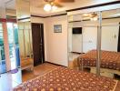 Bedroom with mirrored closet and balcony view