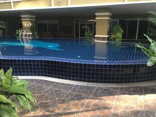 Outdoor pool with tiled flooring