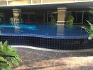 Outdoor pool with tiled flooring