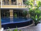 Outdoor swimming pool with surrounding greenery