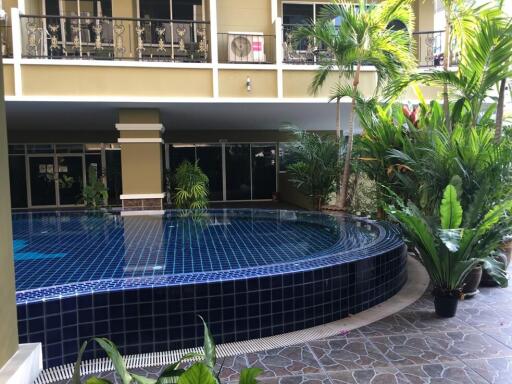 Outdoor swimming pool with surrounding greenery