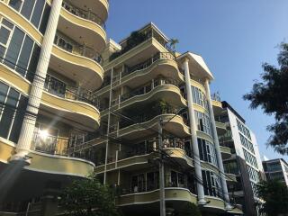 Modern multi-story apartment building with balconies