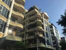 Modern multi-story apartment building with balconies