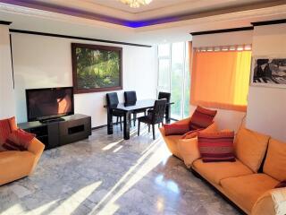 Bright and spacious living room with dining area