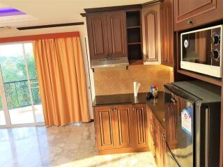 Modern kitchen with wooden cabinets and appliances