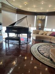 Spacious living room with a grand piano