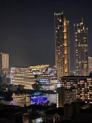 Night view of illuminated city buildings and river