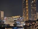 Night view of illuminated city buildings and river