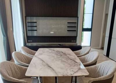 Modern dining room with marble table and upholstered chairs