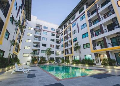 Outdoor view of apartment complex with swimming pool