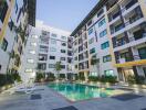 Outdoor view of apartment complex with swimming pool