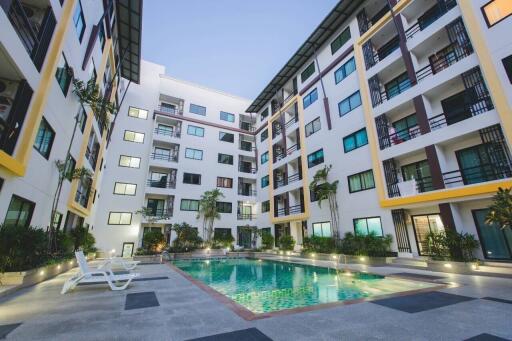 Outdoor view of apartment complex with swimming pool