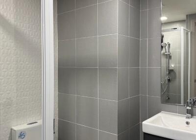 Modern bathroom with grey tiles