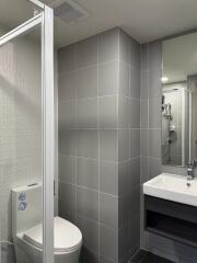 Modern bathroom with grey tiles