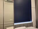 Modern bedroom with mirrored wardrobe and blue accent wall