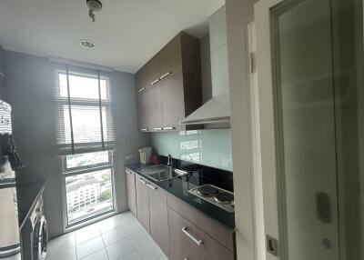 Modern kitchen with large window and built-in appliances