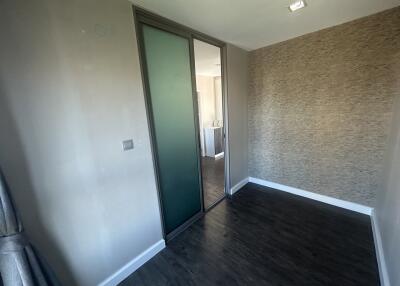 Bedroom with fitted wardrobe and hardwood floor