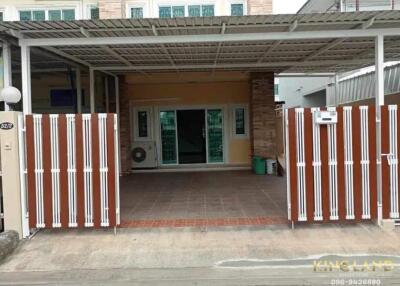 Covered garage with sliding gate