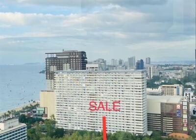 Cityscape view with buildings and sale sign