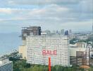 Cityscape view with buildings and sale sign