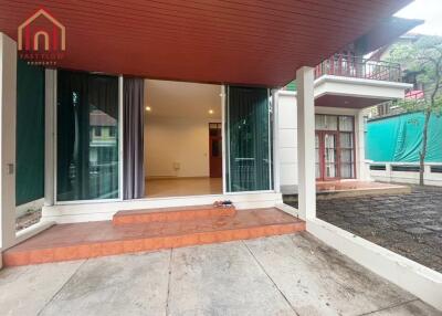 Outdoor patio view with glass sliding doors leading inside