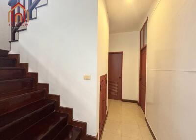 Hallway with staircase and doors