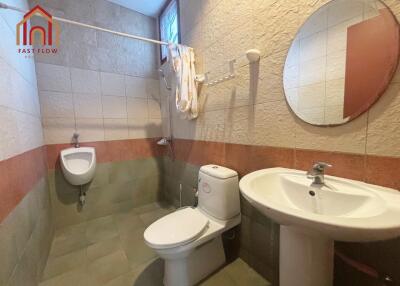 Bathroom with toilet, urinal, and sink