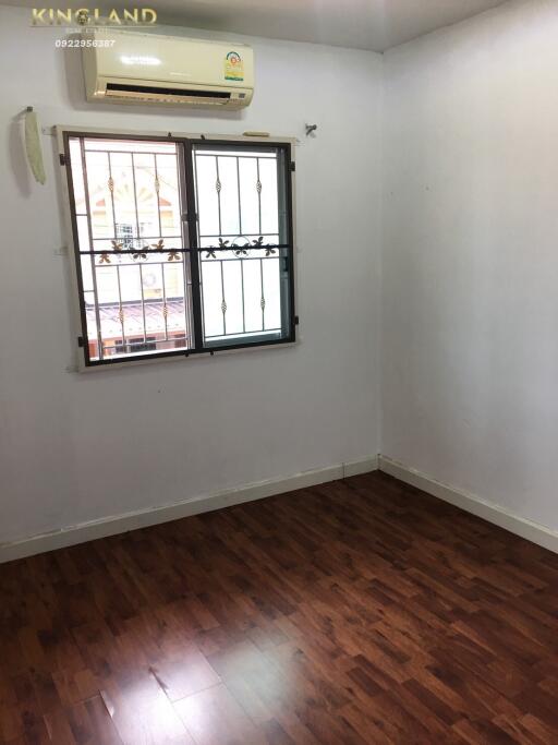 Simple bedroom with window and air conditioner