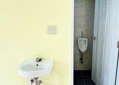 Bathroom with sink and urinal