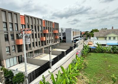 View from property overlooking neighboring buildings and green space