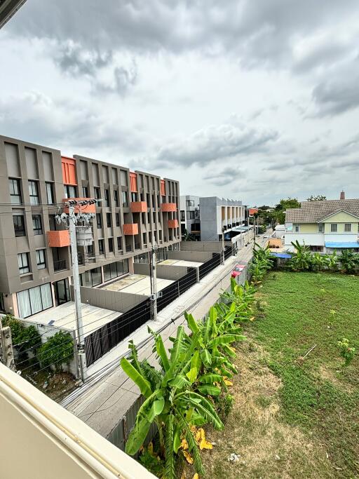 View from property overlooking neighboring buildings and green space