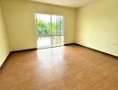 Empty room with large window and tiled floor