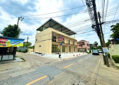 Modern two-story commercial building on a corner lot.