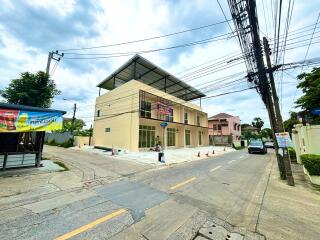 Modern two-story commercial building on a corner lot.