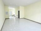 Living room with white tile flooring and recessed lighting