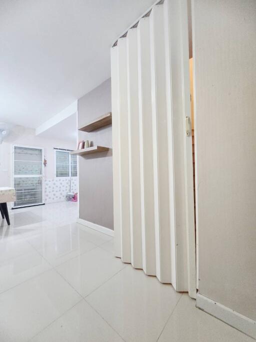 Spacious living area with modern folding door