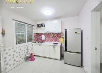 Modern kitchen with white cabinets and appliances