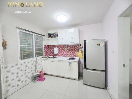 Modern kitchen with white cabinets and appliances